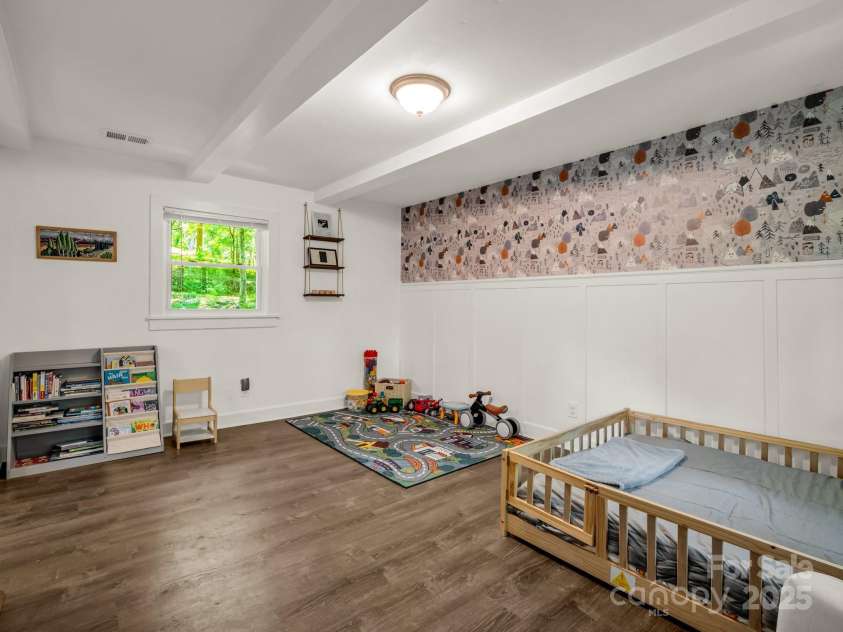 1463 Carolina Drive, Tryon, NC 28782.  MLS# CAR4275838, YatesRealty ID 24578. Guest bedroom on the main level