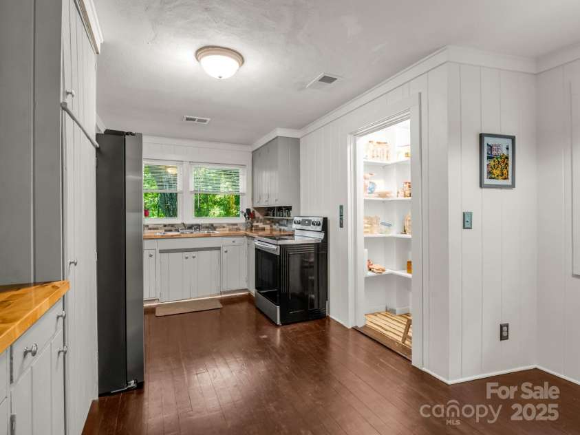 1463 Carolina Drive, Tryon, NC 28782.  MLS# CAR4275838, YatesRealty ID 24578. Kitchen with pantry