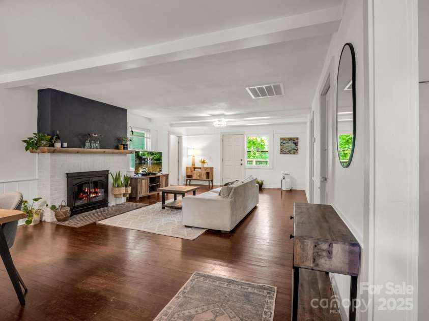 1463 Carolina Drive, Tryon, NC 28782.  MLS# CAR4275838, YatesRealty ID 24578. Living Room has a wood burning fireplace