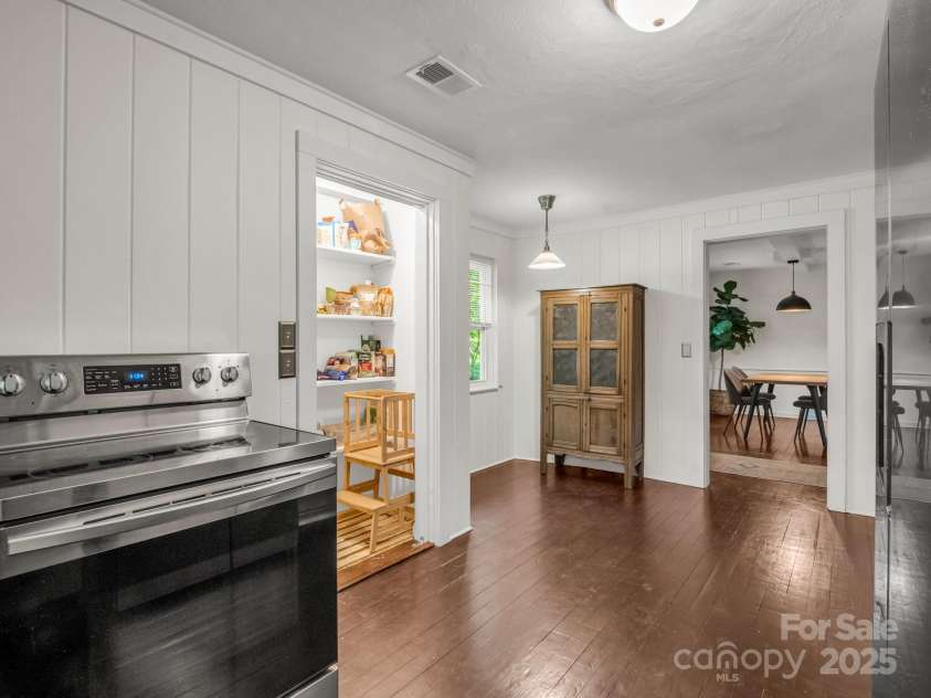 1463 Carolina Drive, Tryon, NC 28782.  MLS# CAR4275838, YatesRealty ID 24578. Looking back toward the dining area