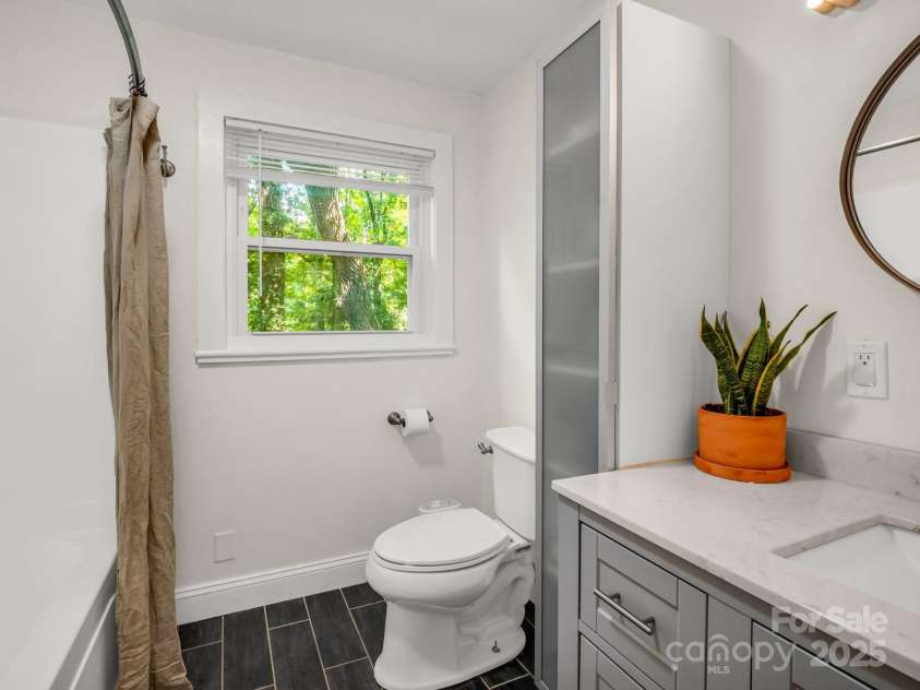 1463 Carolina Drive, Tryon, NC 28782.  MLS# CAR4275838, YatesRealty ID 24578. Primary bathroom with a tub/shower