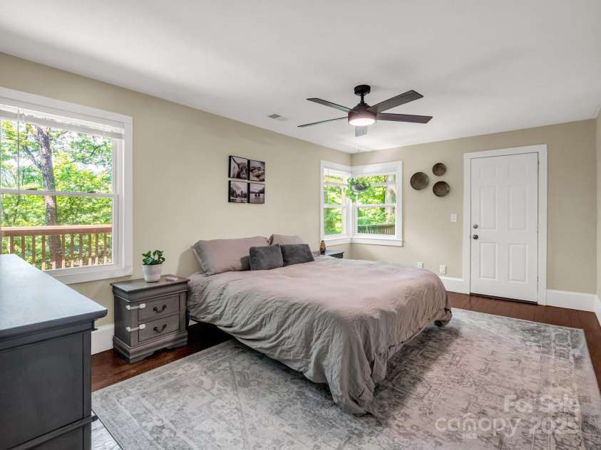 1463 Carolina Drive, Tryon, NC 28782.  MLS# CAR4275838, YatesRealty ID 24578. Primary bedroom with a door to a private deck
