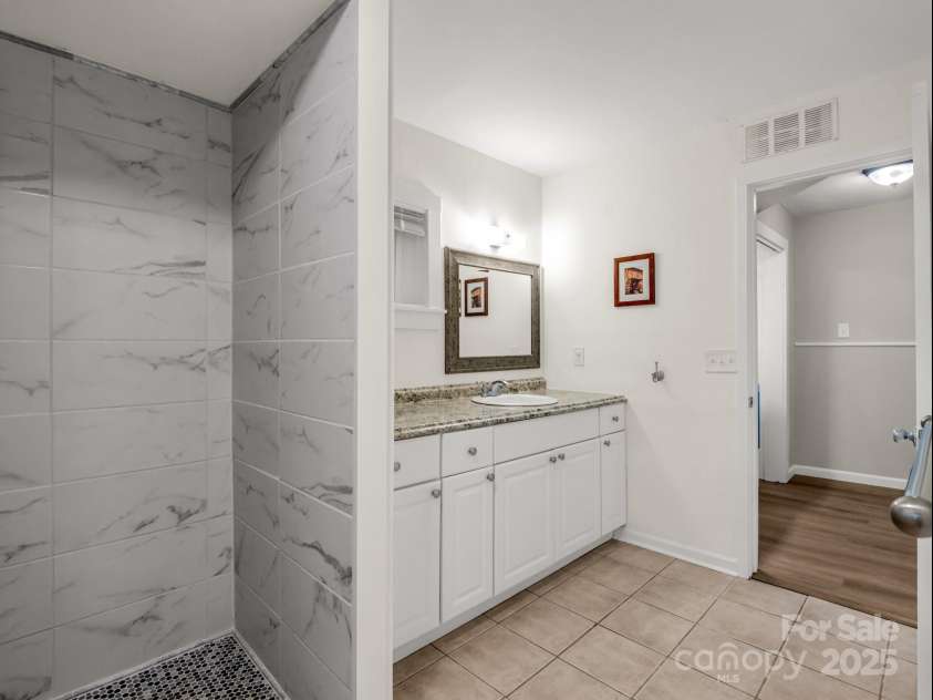 1463 Carolina Drive, Tryon, NC 28782.  MLS# CAR4275838, YatesRealty ID 24578. Tile shower