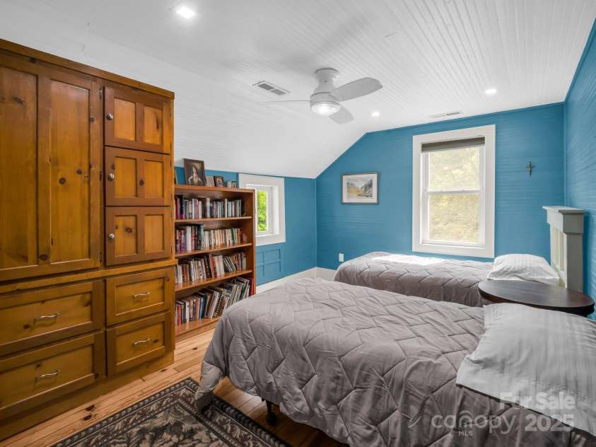 55 Lanier Street, Tryon, NC 28782.  MLS# CAR4276208, YatesRealty ID 24579. Bedroom #1 on the second floor with custom built-ins