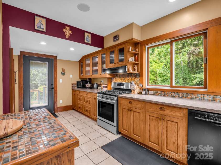55 Lanier Street, Tryon, NC 28782.  MLS# CAR4276208, YatesRealty ID 24579. Custom cabinets