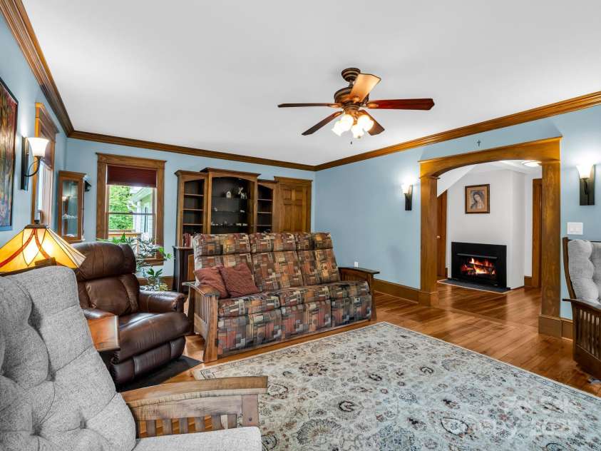 55 Lanier Street, Tryon, NC 28782.  MLS# CAR4276208, YatesRealty ID 24579. Gas log fireplace in the hall outside the Living Room