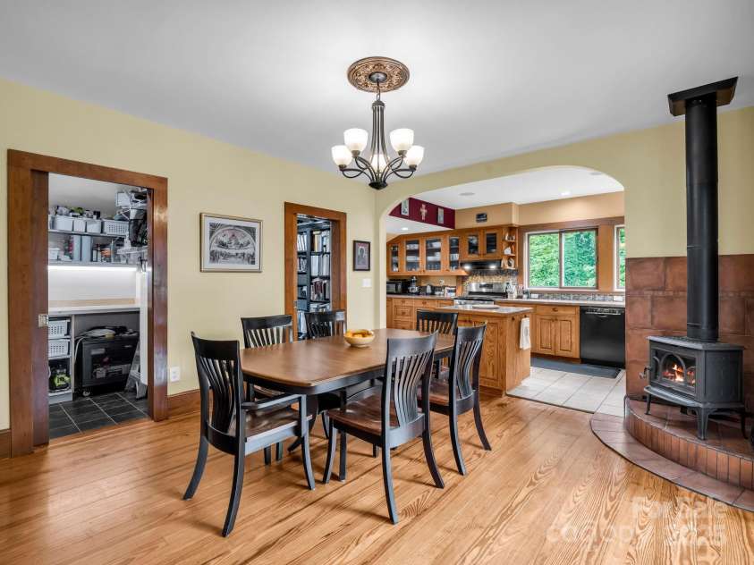 55 Lanier Street, Tryon, NC 28782.  MLS# CAR4276208, YatesRealty ID 24579. Kitchen with wood stove