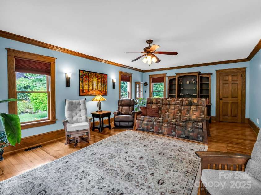 55 Lanier Street, Tryon, NC 28782.  MLS# CAR4276208, YatesRealty ID 24579. Living Room with a closet.  Owners thought about adding a half bath where the closet is.