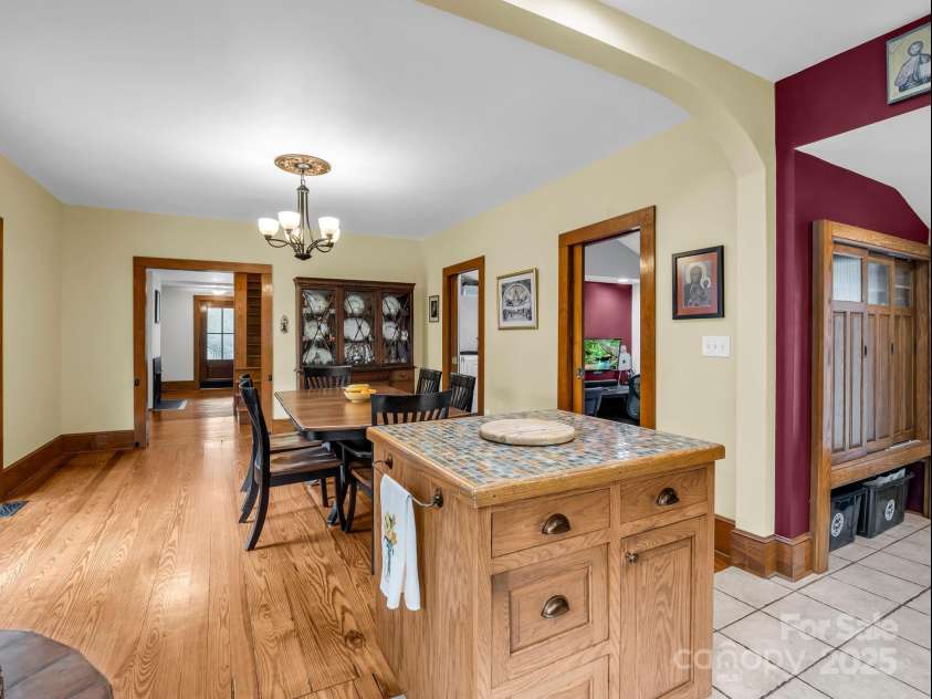 55 Lanier Street, Tryon, NC 28782.  MLS# CAR4276208, YatesRealty ID 24579. Pantry on the right and an island