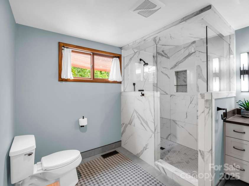 55 Lanier Street, Tryon, NC 28782.  MLS# CAR4276208, YatesRealty ID 24579. Walk-in shower
