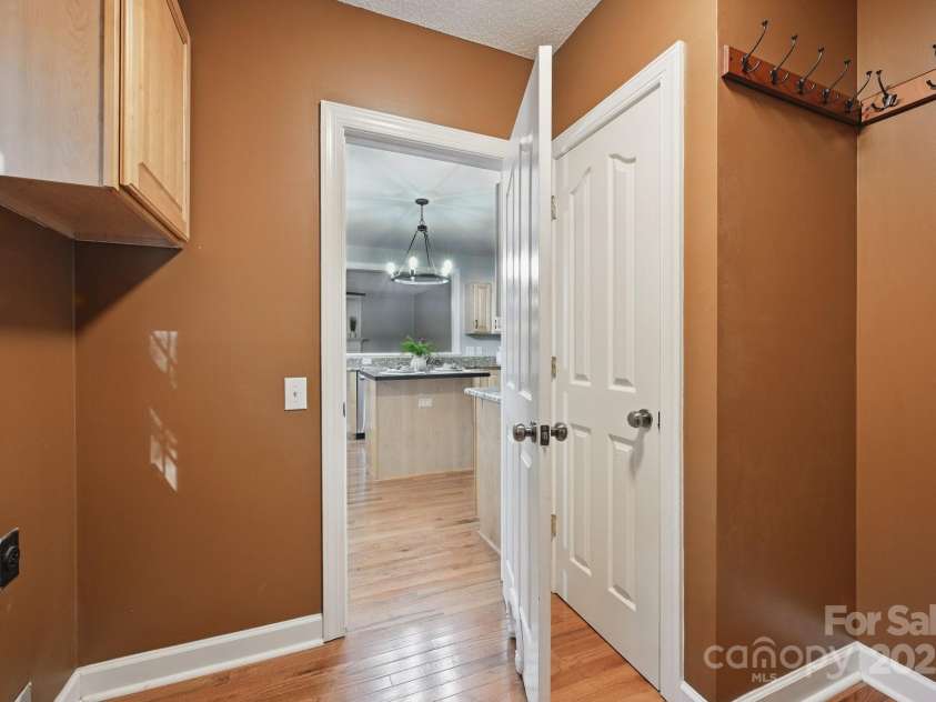 8805 Deerland Court, Huntersville, NC 28078.  MLS# CAR4268981, YatesRealty ID 24592. Laundry room with storage