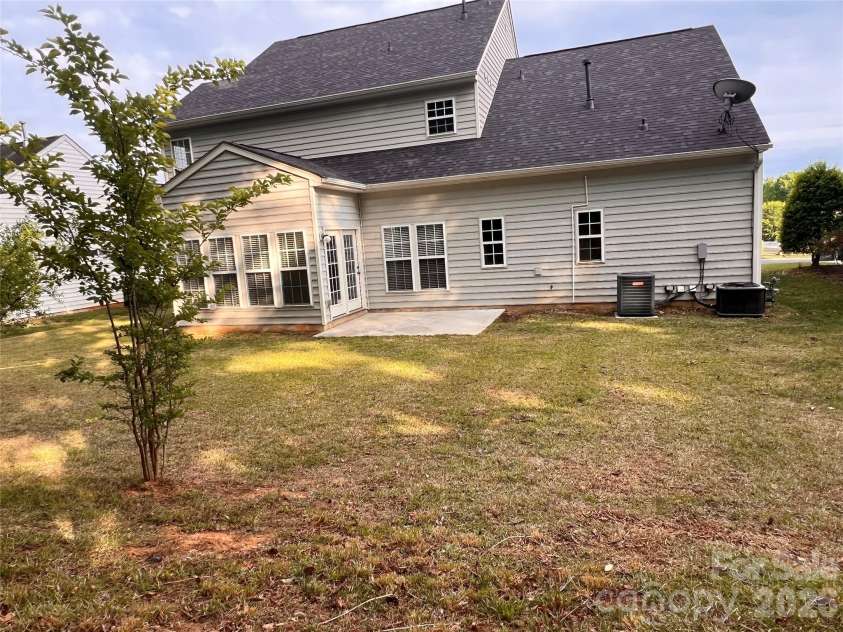 7709 Greylock Ridge Road, Matthews, NC 28105.  MLS# CAR4374056, YatesRealty ID 24593. Backside of house