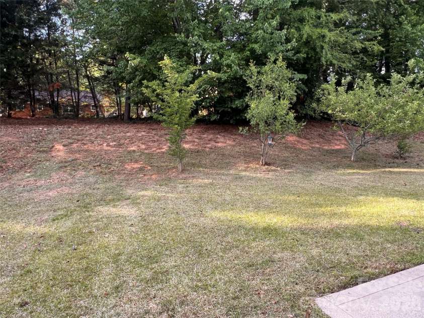 7709 Greylock Ridge Road, Matthews, NC 28105.  MLS# CAR4374056, YatesRealty ID 24593. Backyard and Hill