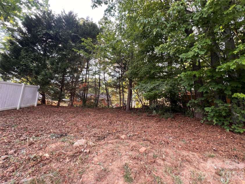 7709 Greylock Ridge Road, Matthews, NC 28105.  MLS# CAR4374056, YatesRealty ID 24593. Flat Hill in Backyard