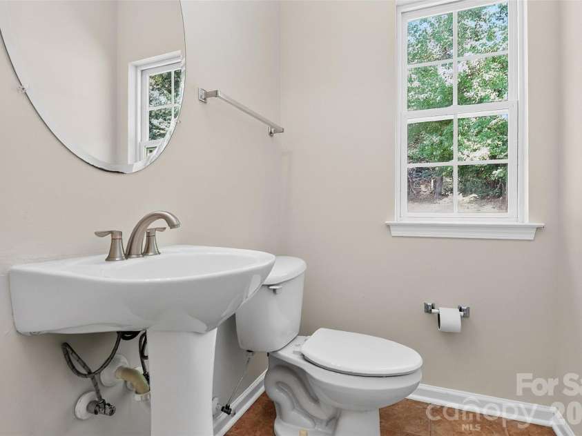 7709 Greylock Ridge Road, Matthews, NC 28105.  MLS# CAR4425798, YatesRealty ID 24593. Half bathroom