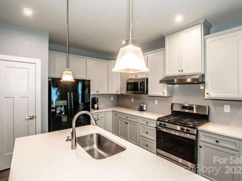 105 Chase View Lane, Troutman, NC 28166.  MLS# CAR4256483, YatesRealty ID 24599. Lots of cabinetry and workspace