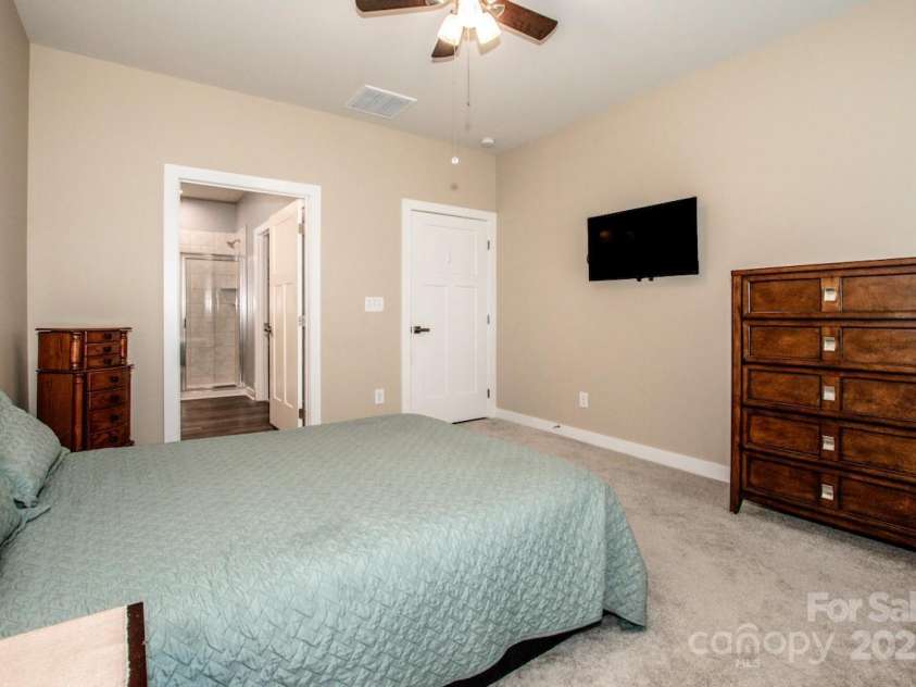 105 Chase View Lane, Troutman, NC 28166.  MLS# CAR4256483, YatesRealty ID 24599. Primary bedroom leading to ensuite bath