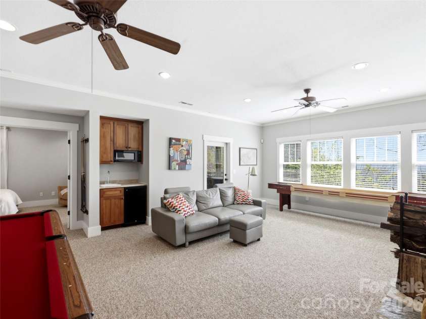 110 Soaring Mountain Drive, Waynesville, NC 28786.  MLS# CAR4378537, YatesRealty ID 24602. Great den, complete with wet bar