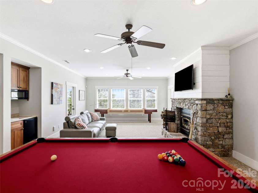 110 Soaring Mountain Drive, Waynesville, NC 28786.  MLS# CAR4378537, YatesRealty ID 24602. Wood-burning fireplace in den
