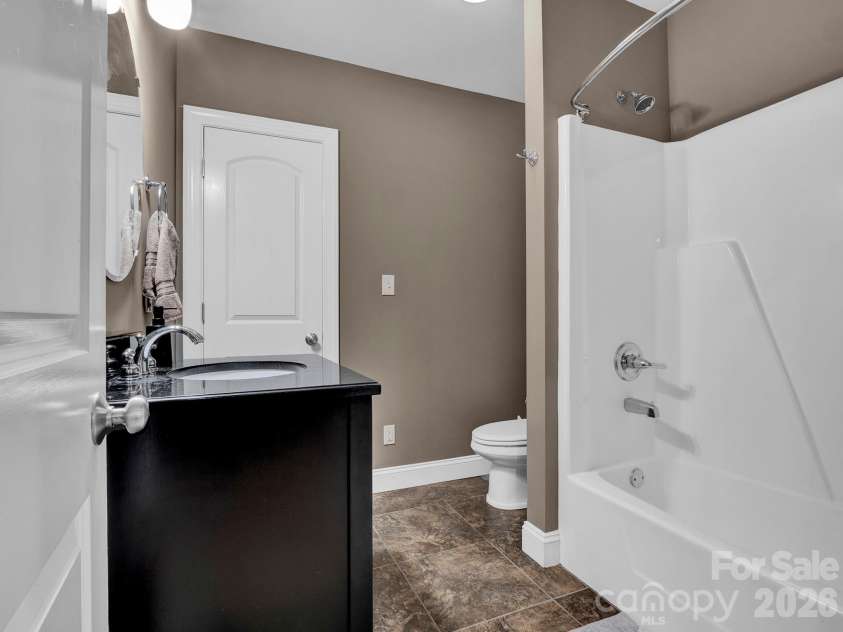 2652 Bedford Place, Concord, NC 28027.  MLS# CAR4368949, YatesRealty ID 24604. Full Bath lower level- opens into rec/main area and storage/flex space.