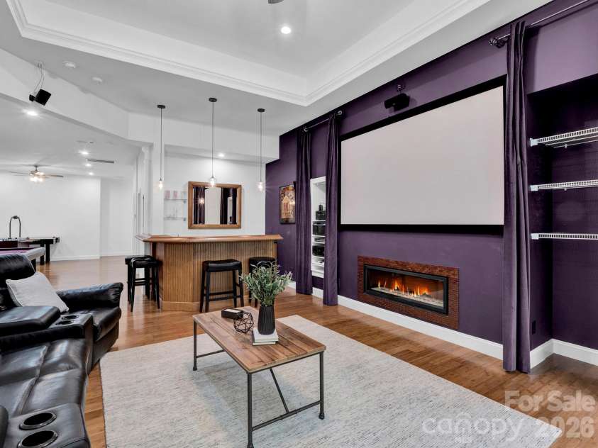 2652 Bedford Place, Concord, NC 28027.  MLS# CAR4368949, YatesRealty ID 24604. Media room with fireplace