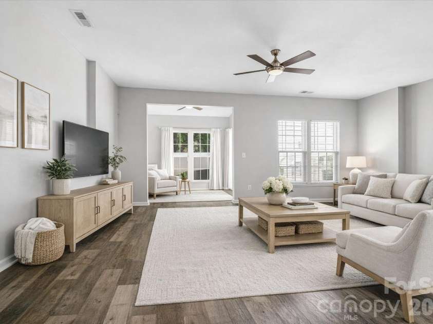 122 Kallie Loop, Mooresville, NC 28117.  MLS# CAR4367976, YatesRealty ID 24608. Living room with additional office/flex space attached. Virtually staged. 