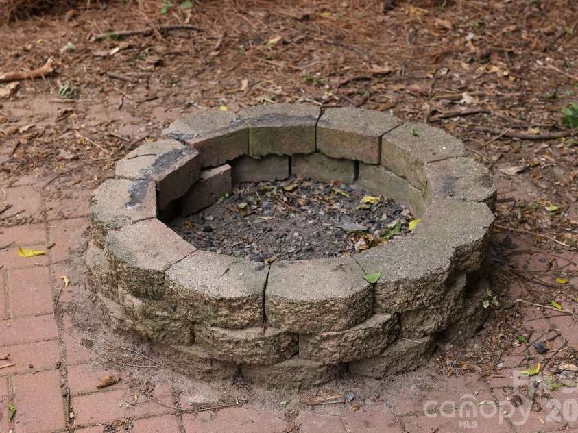 317 Devine Avenue, Belmont, NC 28012.  MLS# CAR4376938, YatesRealty ID 24610. Private fire pit and pad