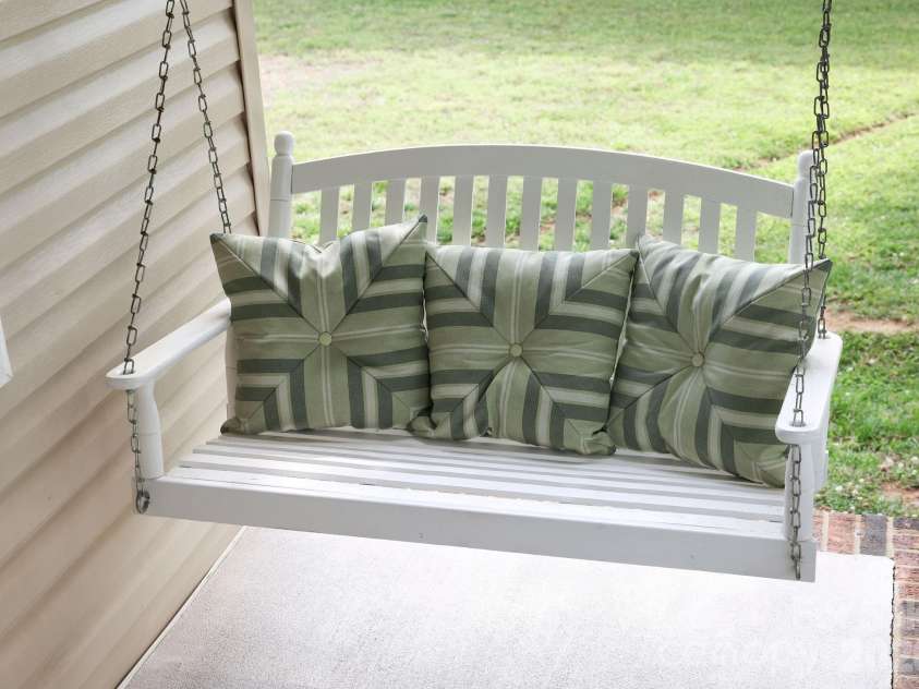 317 Devine Avenue, Belmont, NC 28012.  MLS# CAR4376938, YatesRealty ID 24610. Relax - refreshed porch swing