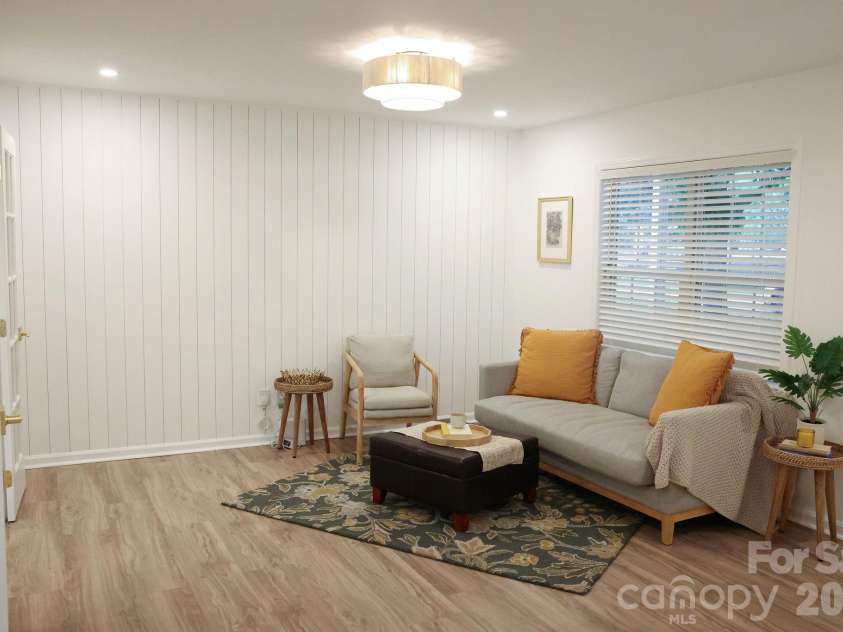 317 Devine Avenue, Belmont, NC 28012.  MLS# CAR4376938, YatesRealty ID 24610. Vertical ship-lap accent wall in living room