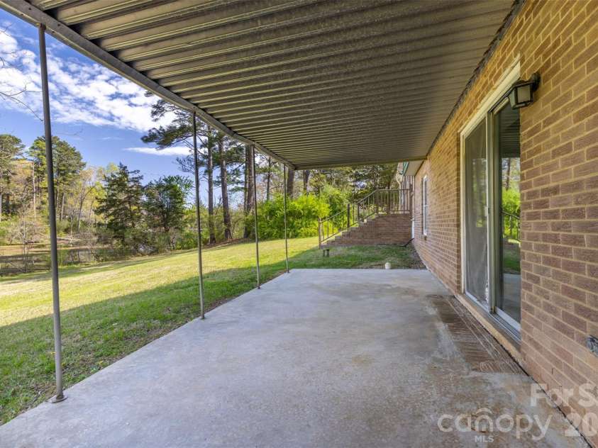 347 Red Fox Trail, Rock Hill, SC 29730.  MLS# CAR4363660, YatesRealty ID 24618. Covered Patio off lower level den.