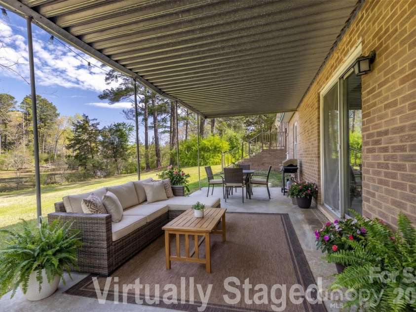 347 Red Fox Trail, Rock Hill, SC 29730.  MLS# CAR4363660, YatesRealty ID 24618. Virtually Staged Covered Patio off lower level den.