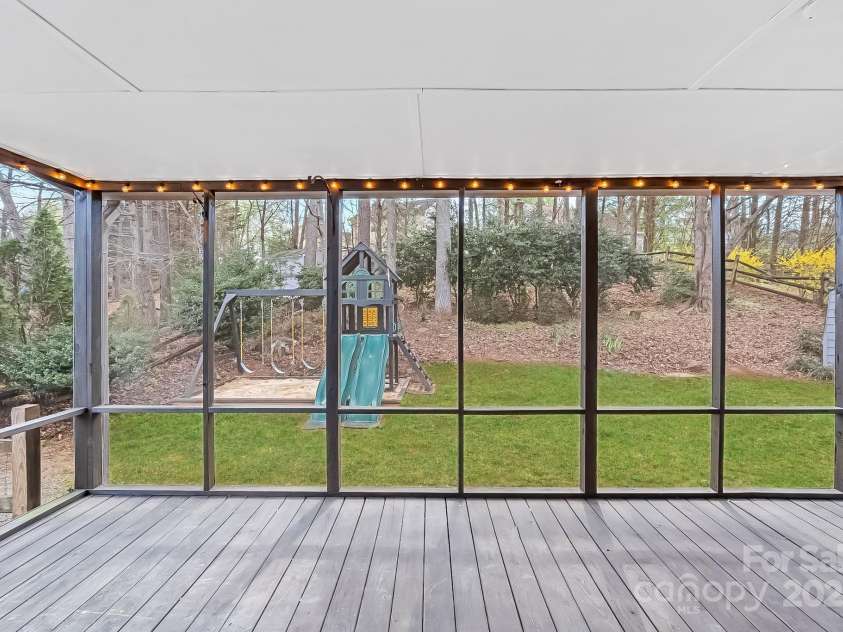 9027 Twin Trail Drive, Huntersville, NC 28078.  MLS# CAR4198608, YatesRealty ID 2462. Screened Patio with backyard view