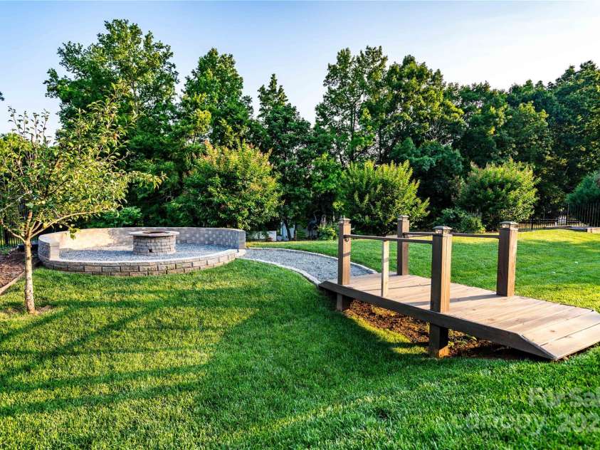 159 Holly Ridge Drive, Mooresville, NC 28115.  MLS# CAR4266521, YatesRealty ID 24623. Cozy fire pit for cold evenings