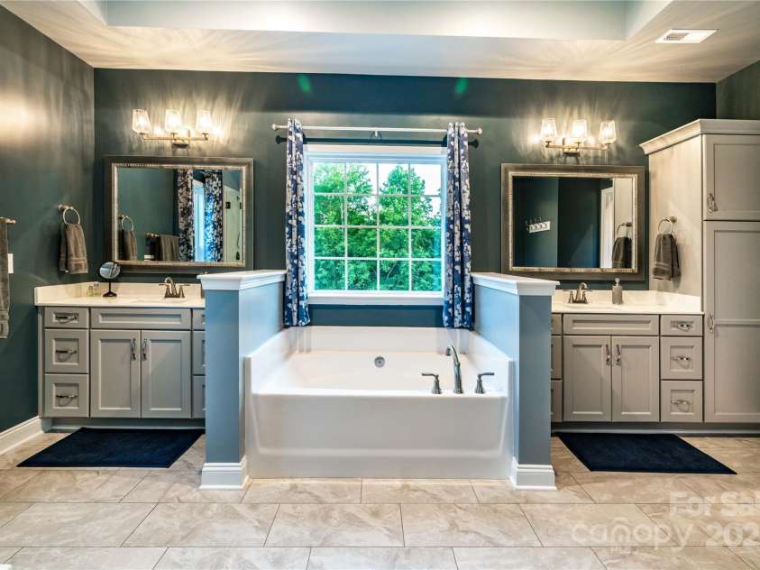 159 Holly Ridge Drive, Mooresville, NC 28115.  MLS# CAR4266521, YatesRealty ID 24623. Stunning primary bath