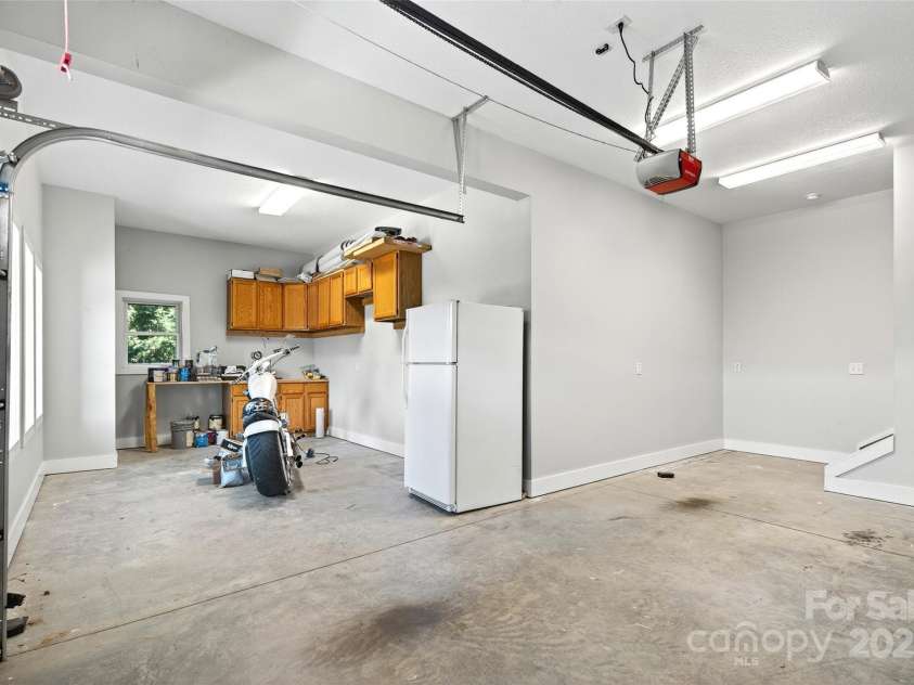 4 Stars Forever Drive, Black Mountain, NC 28711.  MLS# CAR4276305, YatesRealty ID 24633. Garage w/ shop