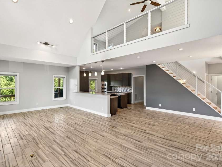 4 Stars Forever Drive, Black Mountain, NC 28711.  MLS# CAR4276305, YatesRealty ID 24633. Living Room into Kitchen