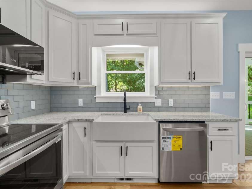 68 Bamboo Trail, Candler, NC 28715.  MLS# CAR4257307, YatesRealty ID 24635. Beautiful farm sink overlooking the serene grounds