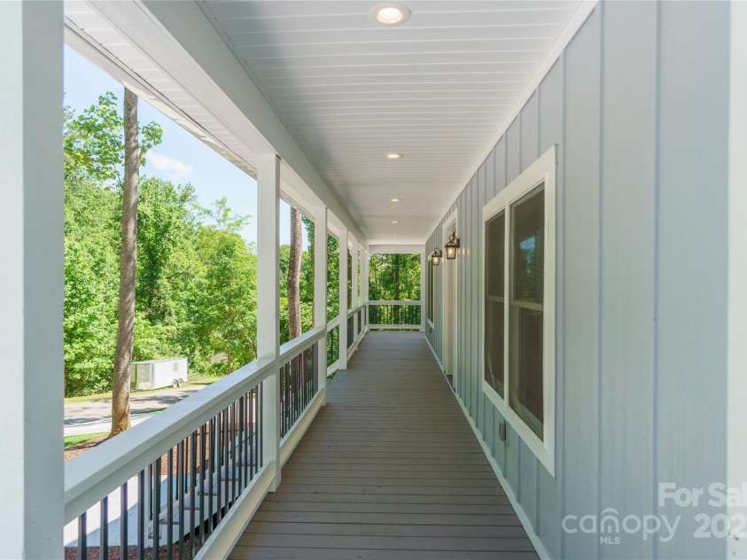 68 Bamboo Trail, Candler, NC 28715.  MLS# CAR4257307, YatesRealty ID 24635. Beautiful wrap around covered porches