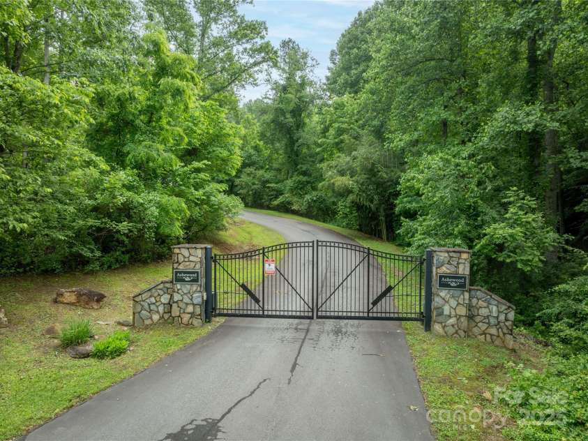 68 Bamboo Trail, Candler, NC 28715.  MLS# CAR4257307, YatesRealty ID 24635. Elegant entry gate with remote and keypad for guests