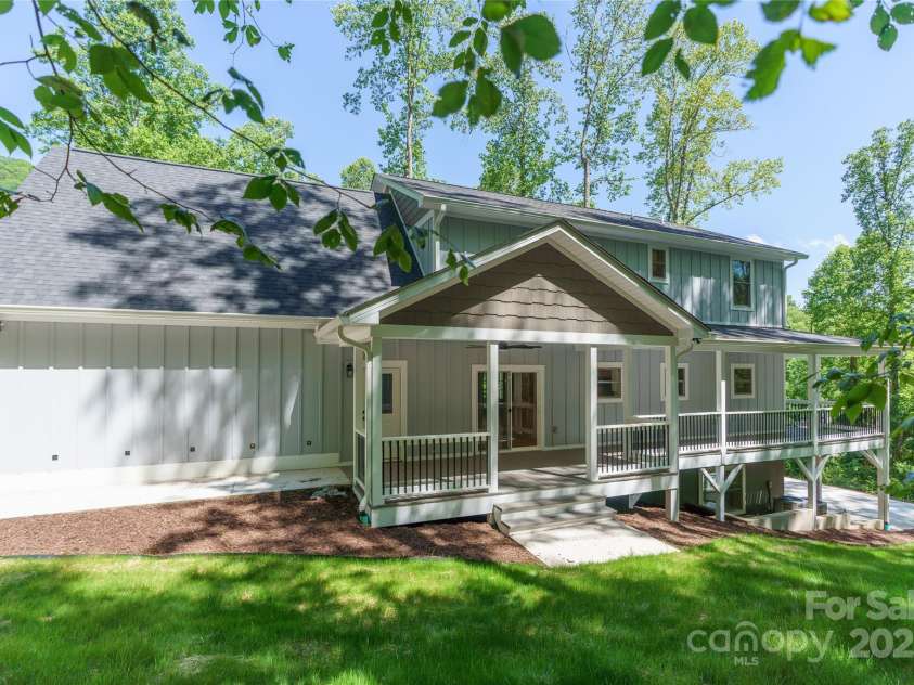 68 Bamboo Trail, Candler, NC 28715.  MLS# CAR4257307, YatesRealty ID 24635. Relax in complete privacy on the back covered porch with ceiling fan