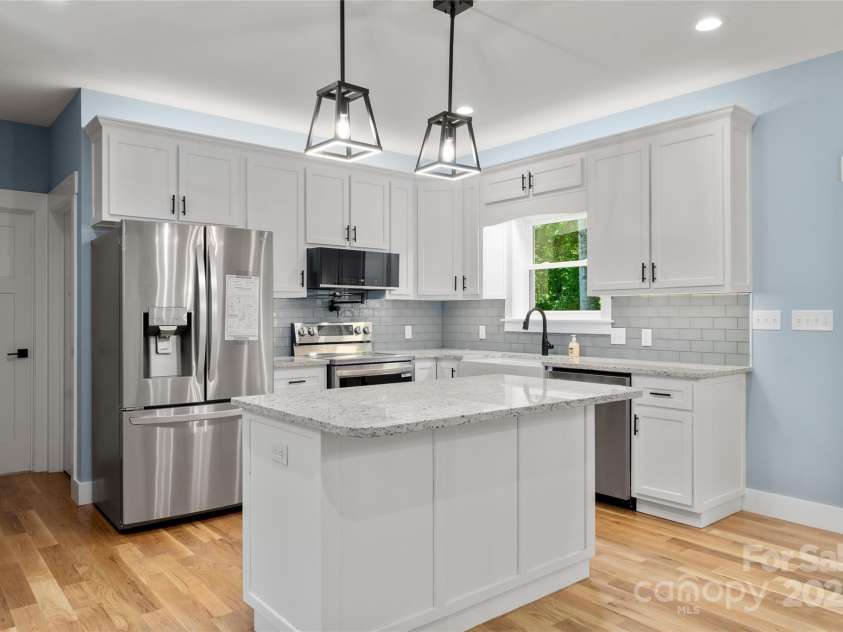 68 Bamboo Trail, Candler, NC 28715.  MLS# CAR4257307, YatesRealty ID 24635. So many extras in this custom kitchen with it's mood lighting and pot filler