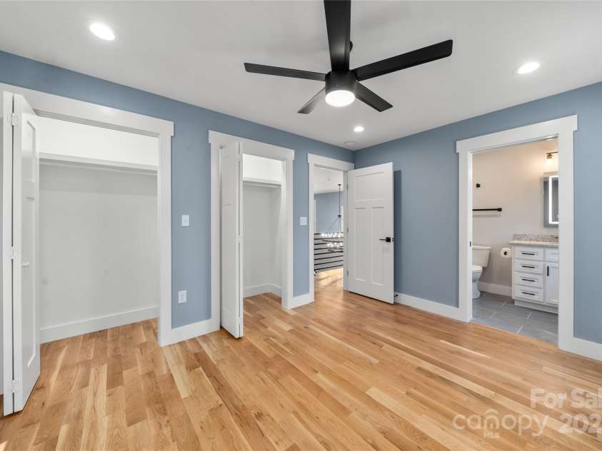 68 Bamboo Trail, Candler, NC 28715.  MLS# CAR4257307, YatesRealty ID 24635. Upper level ensuite bedroom three with huge closets