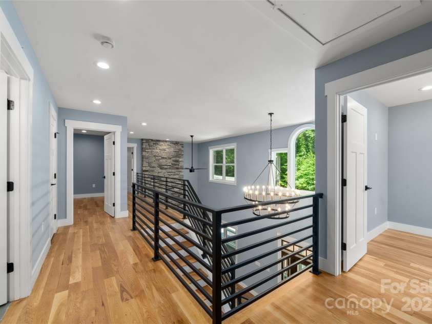 68 Bamboo Trail, Candler, NC 28715.  MLS# CAR4257307, YatesRealty ID 24635. Upper level hall overlooking great room.