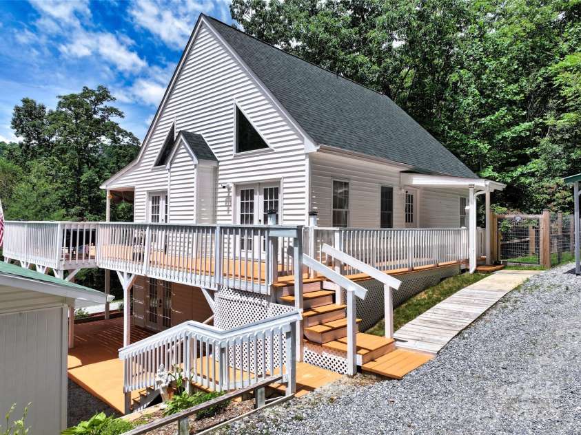 186 Hawks Point Drive, Zirconia, NC 28790.  MLS# CAR4302595, YatesRealty ID 24638. Back of house entry from carport area