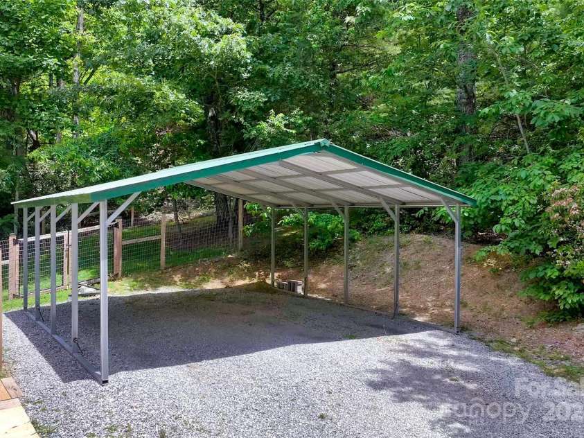 186 Hawks Point Drive, Zirconia, NC 28790.  MLS# CAR4302595, YatesRealty ID 24638. Carport & fenced dog yard