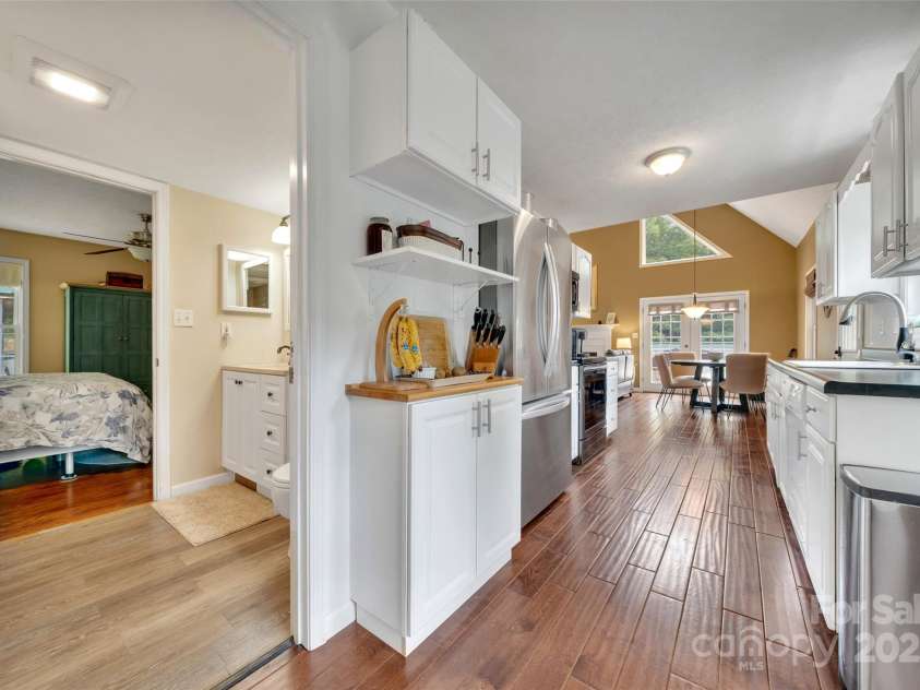 186 Hawks Point Drive, Zirconia, NC 28790.  MLS# CAR4302595, YatesRealty ID 24638. Kitchen & Primary Bathroom