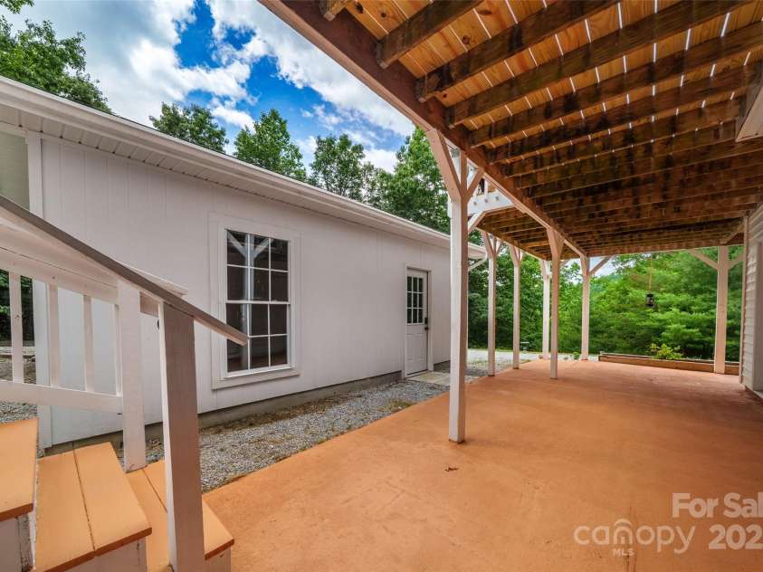 186 Hawks Point Drive, Zirconia, NC 28790.  MLS# CAR4302595, YatesRealty ID 24638. Lower level porch & garage