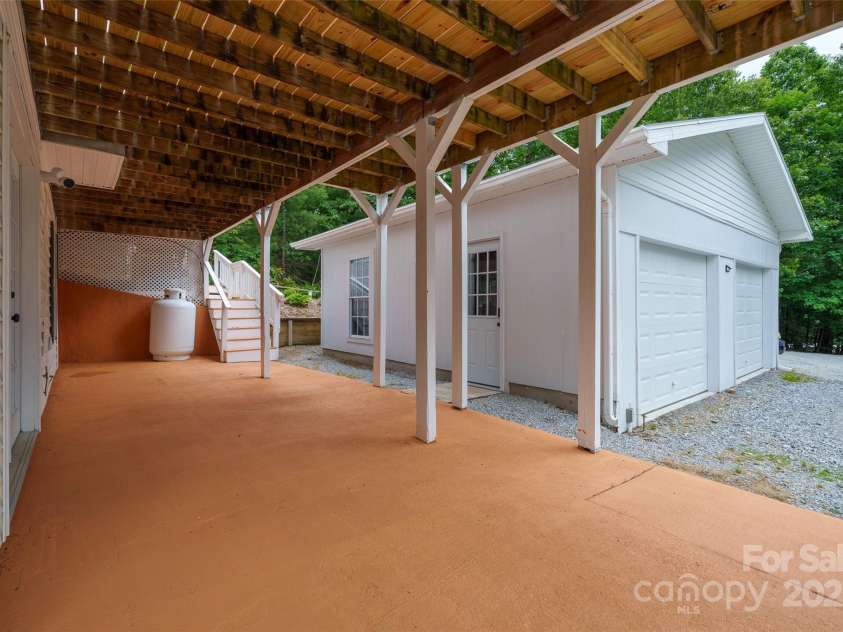 186 Hawks Point Drive, Zirconia, NC 28790.  MLS# CAR4302595, YatesRealty ID 24638. Lower level porch & garage