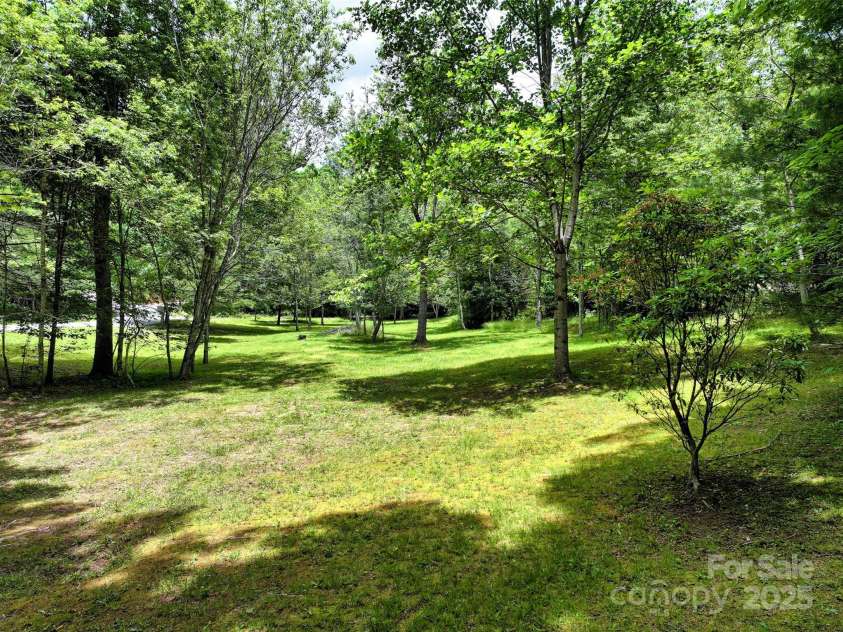 186 Hawks Point Drive, Zirconia, NC 28790.  MLS# CAR4302595, YatesRealty ID 24638. Lower yard area