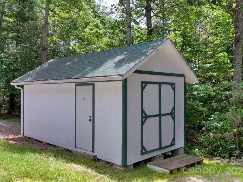 186 Hawks Point Drive, Zirconia, NC 28790.  MLS# CAR4302595, YatesRealty ID 24638. Storage Shed with power